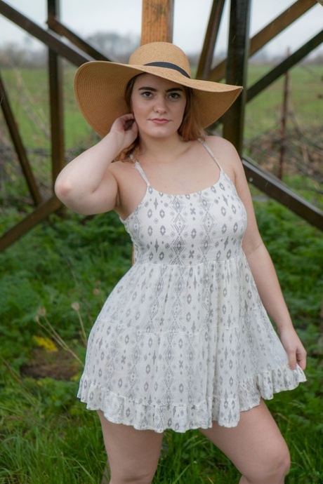 Country girl lifts her dress for naked upskirt showing bald twat and ass
