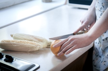 Horny blonde Emma Fantazy slips a cob of corn inside her shaved vagina