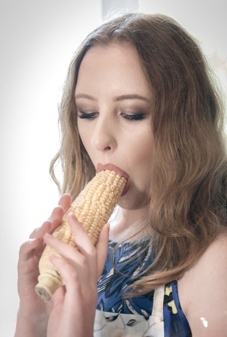 Horny blonde Emma Fantazy slips a cob of corn inside her shaved vagina