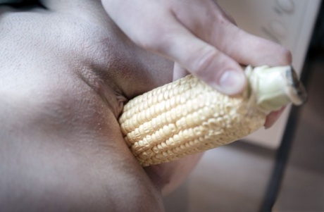 Horny blonde Emma Fantazy slips a cob of corn inside her shaved vagina