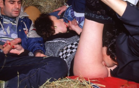 Rich lady sports red lips while getting gangbanged by farm hands in hay loft