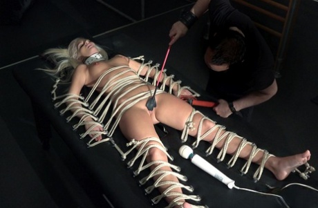 Platinum blonde sex slave gets fucked after being released from her cage