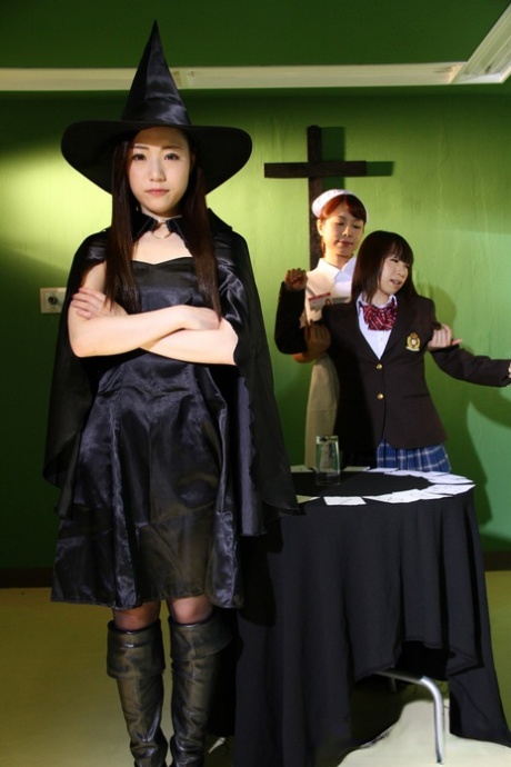 Japanese chicks practice the dark arts while wearing cosplay outfits