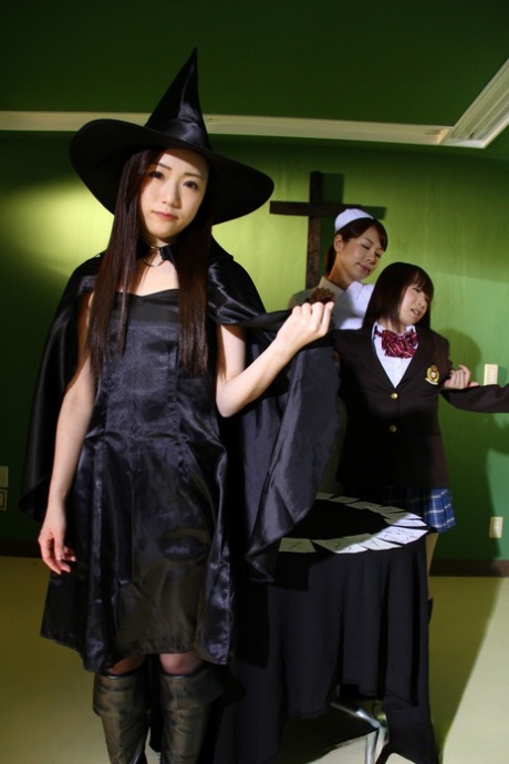 Japanese chicks practice the dark arts while wearing cosplay outfits
