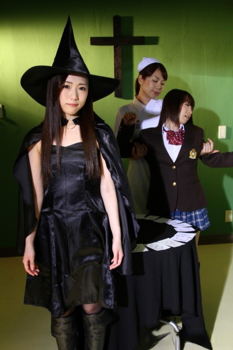 Japanese chicks practice the dark arts while wearing cosplay outfits