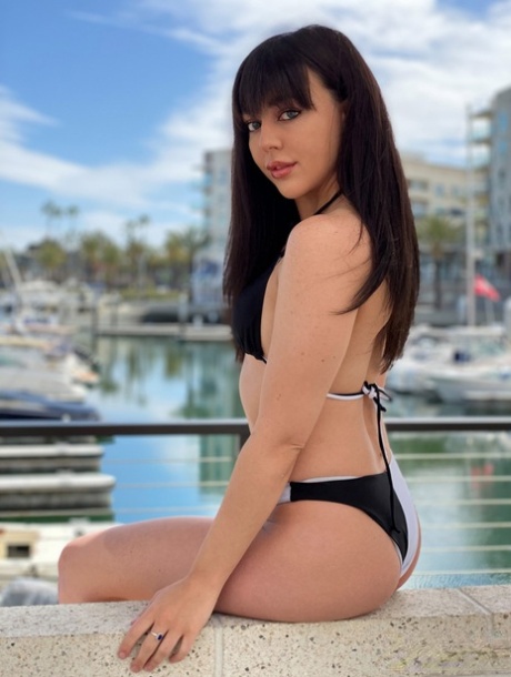 Brunette girl Whitney Wright models a bikini at a marina before having sex