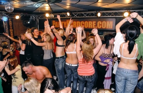 A bunch of chicks on a girl's night out suck and fuck male strippers