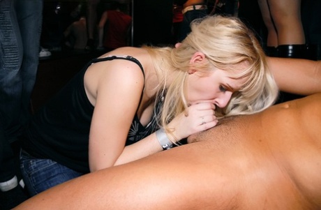 A bunch of chicks on a girl's night out suck and fuck male strippers