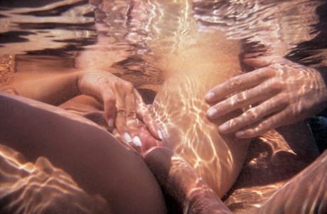 Caucasian chick Wanda gets jizz on her goggles after sex in the water