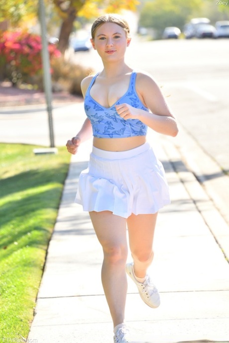 Cute amateur Zoey Zimmer uncovers her firm tits on a public sidewalk