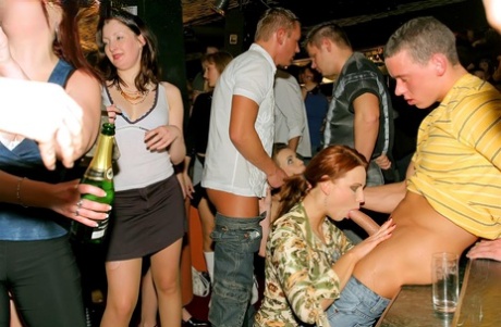 Clubbing females have sex with each other and men as an orgy breaks out