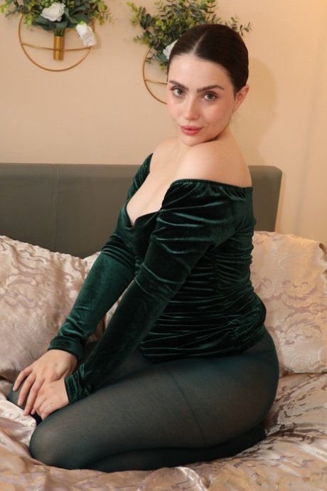 Beautiful brunette Little Miss Fox strips to her pantyhose in a teasing manner