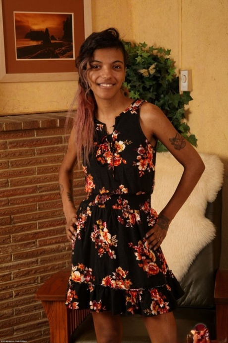 Black amateur Yvette presents her slim body and hairy twat in a solo