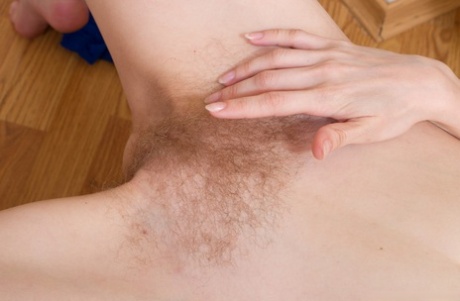 Alluring redhead Vanessa T unveils her small breasts & her hairy pussy