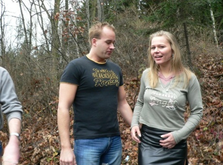 Sexy amateur MILF Moira gets facialed by two blonde guys in the forest