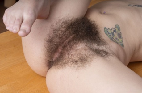 Amateur girl with tattoos Pearl Sage flaunts her hairy armpits and crotch