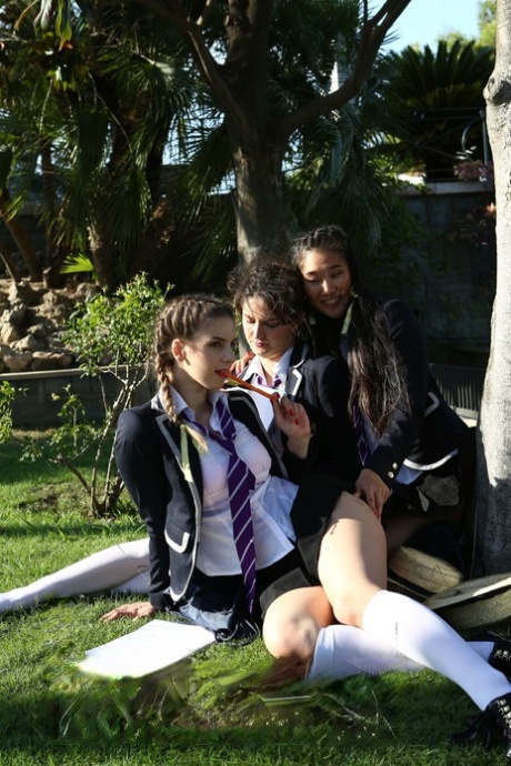 Hot schoolgirls Francesca DiCaprio & Kira Queen pet natural tits under a tree