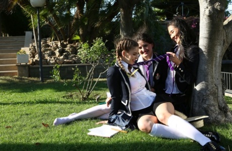 Hot schoolgirls Francesca DiCaprio & Kira Queen pet natural tits under a tree