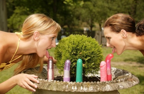 Alluring teens Helena & Andrea try out their new collection of toys outdoors