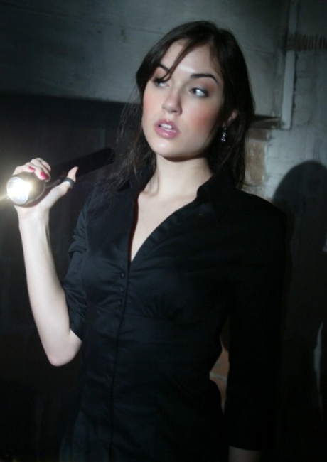 Brunette journalist Sasha Grey gets a rough face fuck in the armory at night