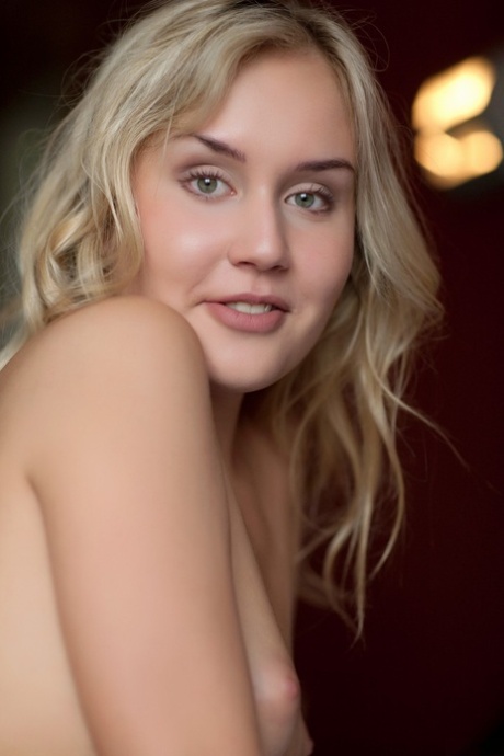 Cute blonde teen Monique B teases with her nice ass in hot stockings