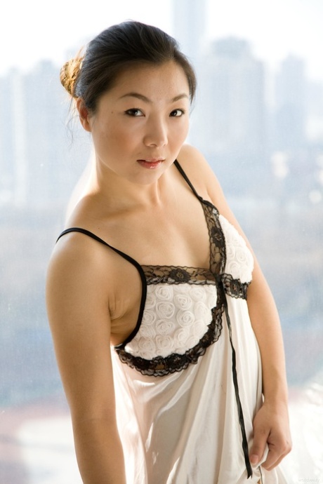 Charming Asian teen Ada E showing her big edible clit & her ripe breasts