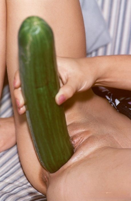 Lesbian teens fuck each other's tight pussies with a monster cucumber