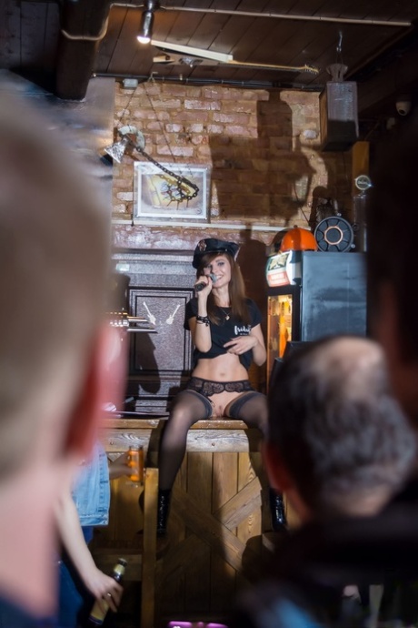 Hot stripper Jeny Smith loses her clothes at the bar & poses in her stockings