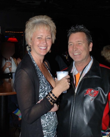 Mature swinger Tracy Lick reveals her big juggs and gets blacked at a club