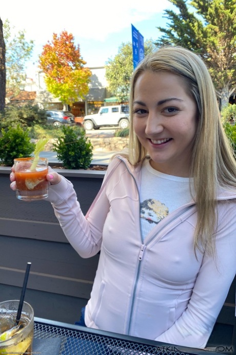 Pretty amateur teen Lily Adams showing off her shaved pussy with a tampon