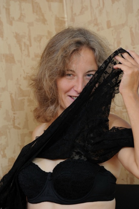 Amateur doll Olga strips to her stockings & shows her hairy mature pussy