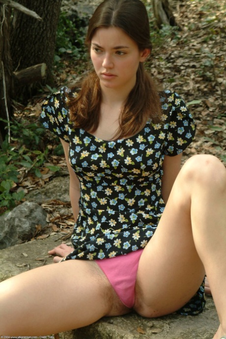 Amateur honey Josie doffs her pink undies and reveals her hairy pussy outdoors