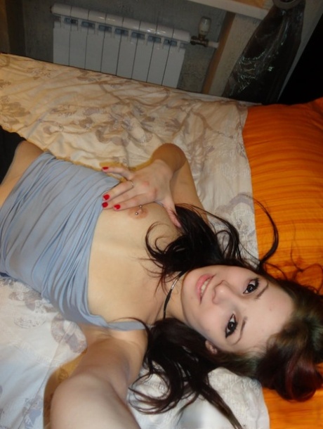 Slutty amateur babe touching her sexy inked body & pussy in a solo