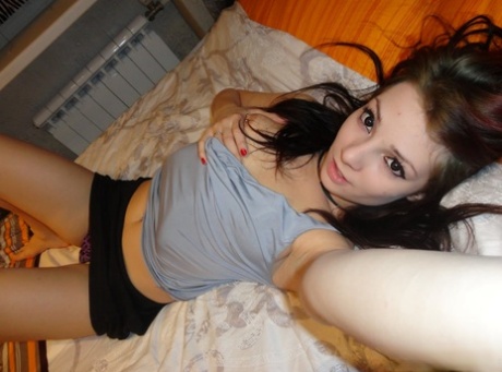 Slutty amateur babe touching her sexy inked body & pussy in a solo