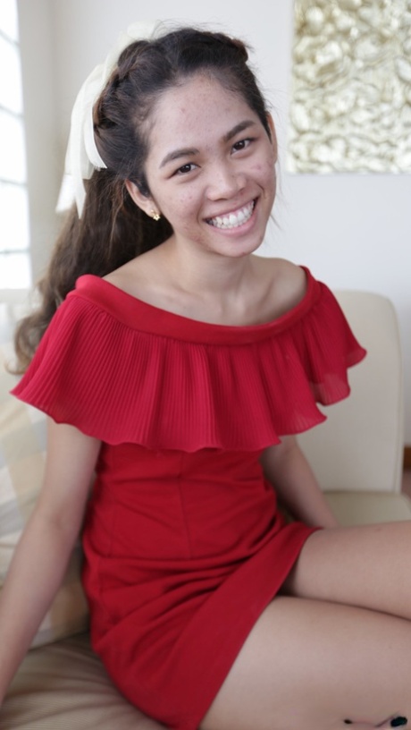 Beautiful Asian girl Mee shows off her hot legs in a short red dress