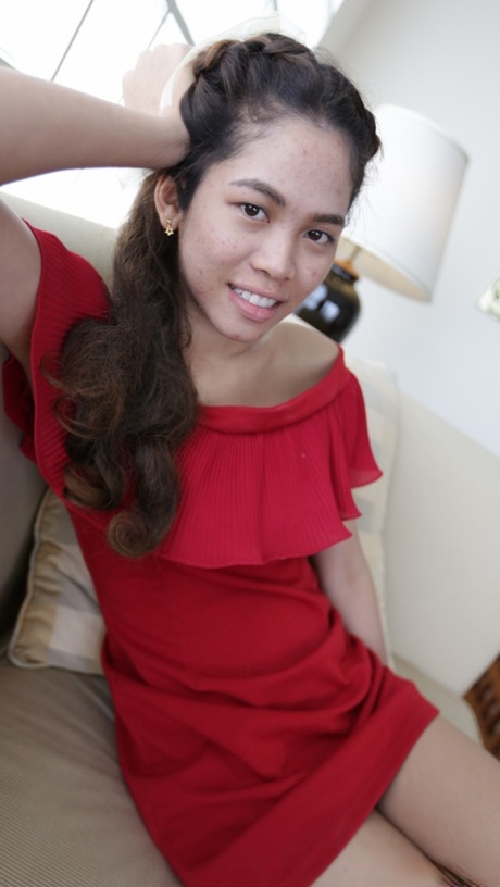 Beautiful Asian girl Mee shows off her hot legs in a short red dress