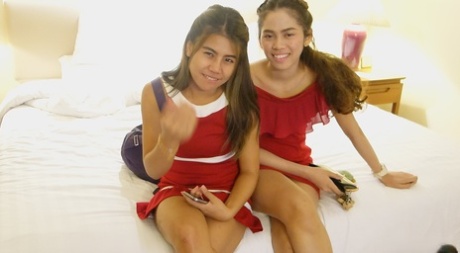 Beautiful Asian girl Mee shows off her hot legs in a short red dress