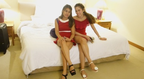 Beautiful Asian girl Mee shows off her hot legs in a short red dress