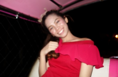 Beautiful Asian girl Mee shows off her hot legs in a short red dress