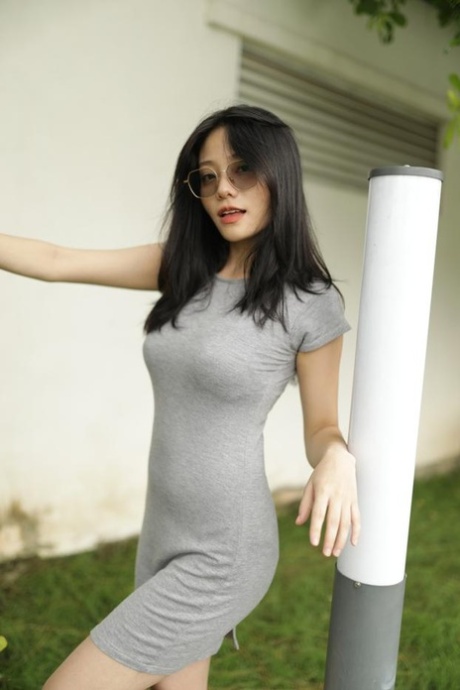 Raven-haired Asian Elena lifts her dress up & shows her boobs in her black bra