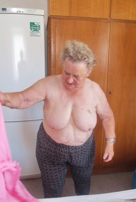 Old granny Advotia strips down naked and exposes her saggy tits & chubby body