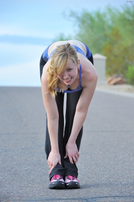 Skinny blonde Emilee exposes her tits while jogging and gets naked at home